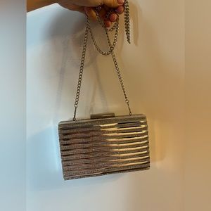 Metallic silver clutch with removable chain strap